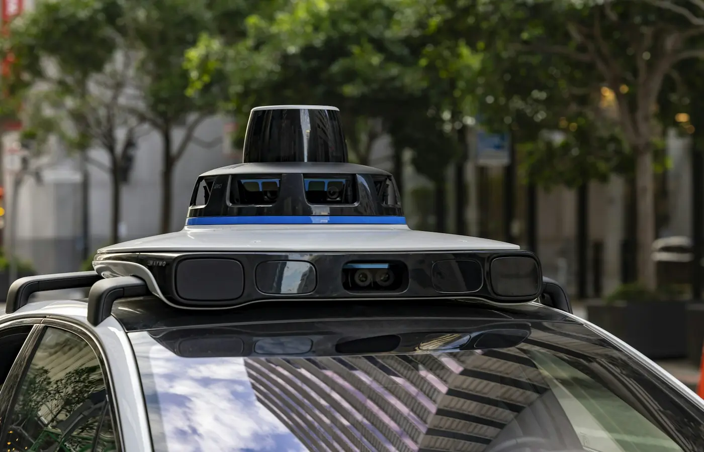 Self-driving car with sensors on city street