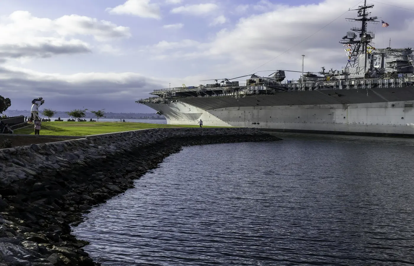 A large ship is docked in a harbor