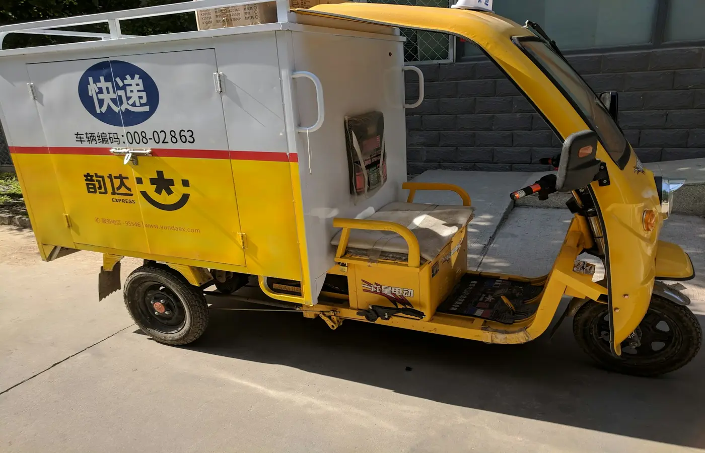 yellow auto rickshaw